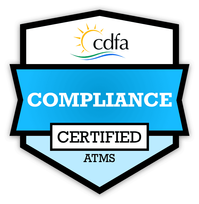 Shield‑shaped badge reading ‘COMPLIANCE CERTIFIED ATMS’ with the CDFA logo, indicating state regulatory approval for NEMT operations.